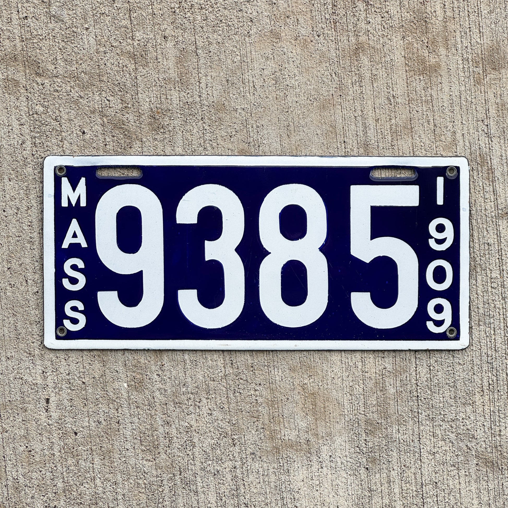 Photo of a 1909 Massachusetts Porcelain License Plate Auto Tag Garage Decor Vintage High Quality Low Number Four Digit 9385 with original patina