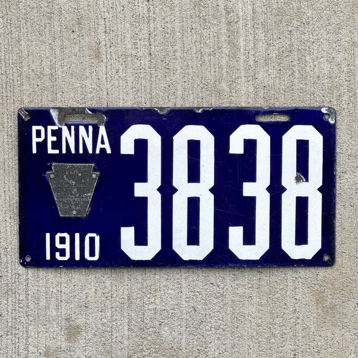 Photo of a 1910 Pennsylvania Porcelain License Plate Auto Tag Garage Decor Vintage 3838 with original patina