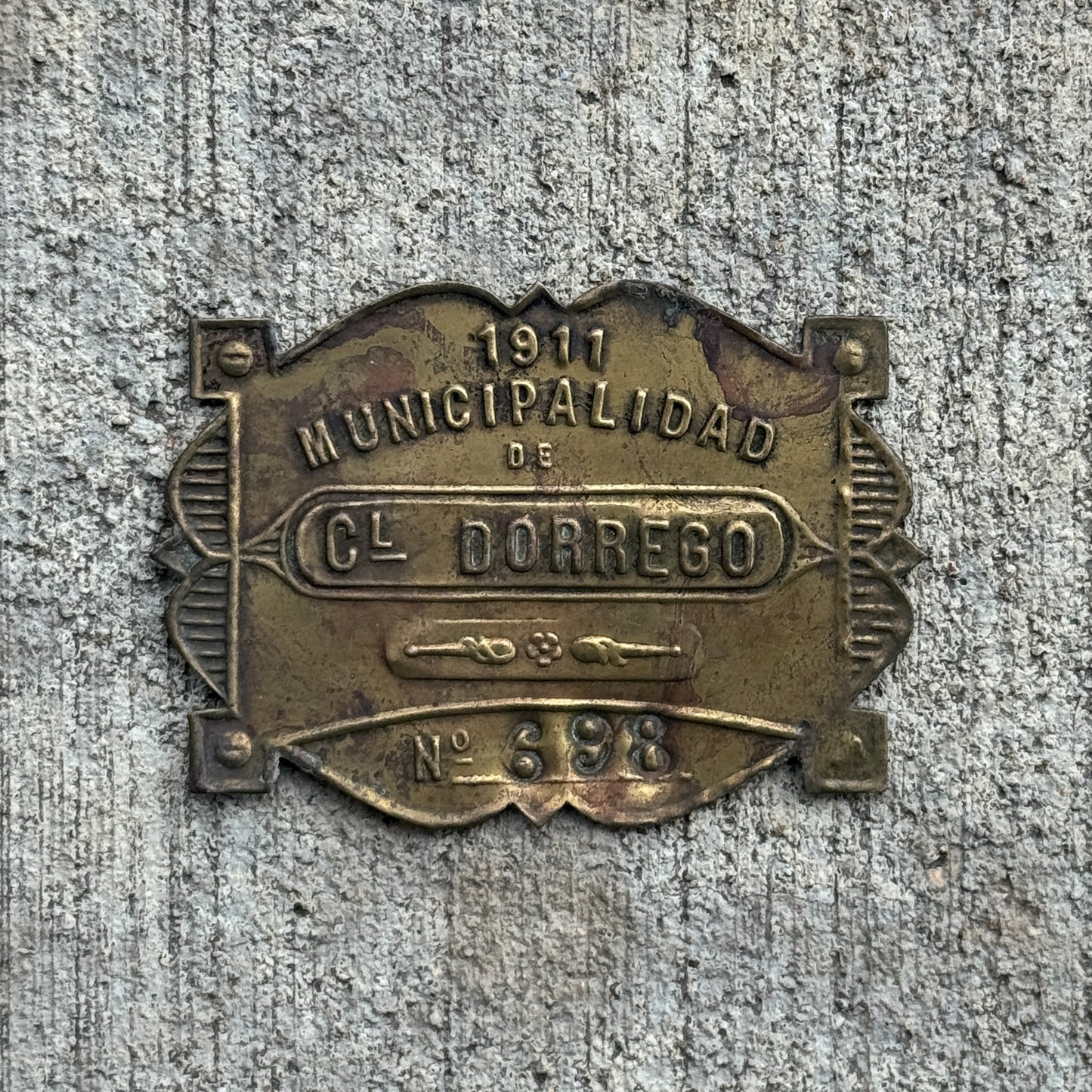Photo of a 1911 Coronel Dorrego Argentina Auto Tag Garage Decor Vintage Badge 698 with original patina