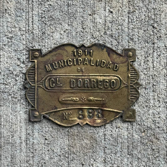 Photo of a 1911 Coronel Dorrego Argentina Auto Tag Garage Decor Vintage Badge 698 with original patina