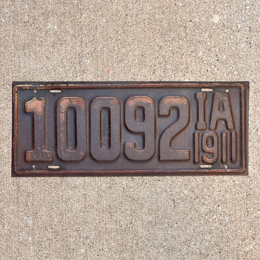 Photo of a 1911 Iowa License Plate Auto Tag 2 Garage Decor First Issue 10092 with original patina