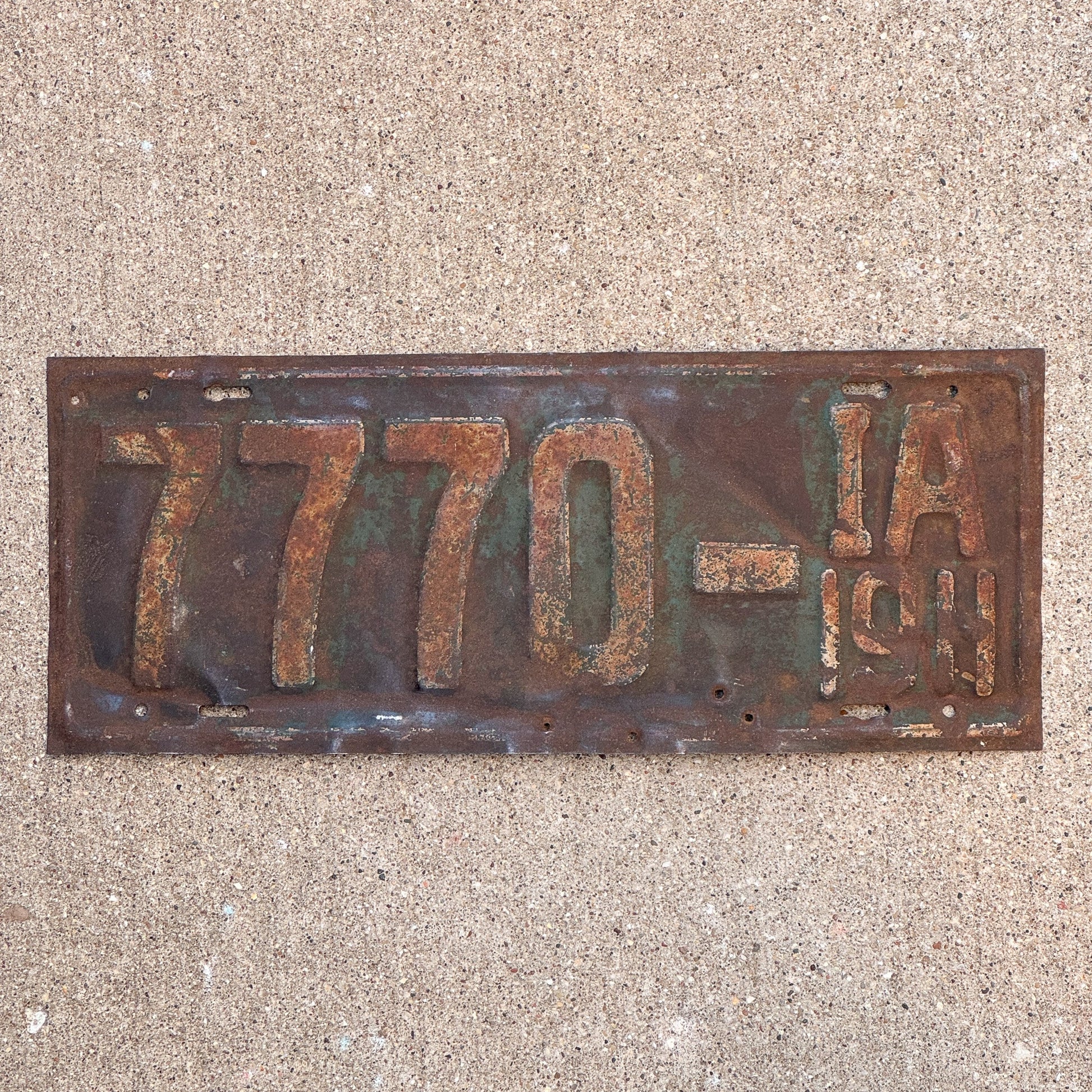 Photo of a 1911 Iowa License Plate Auto Tag Garage Decor Vintage First Issue Lucky 7 Repeat Repeating 7770 with original patina
