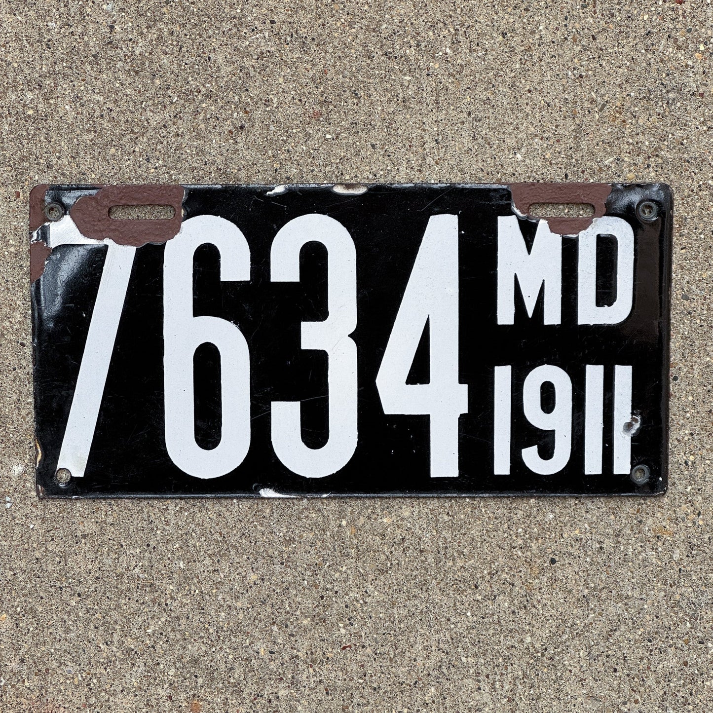 Photo of a 1911 Maryland Porcelain License Plate Auto Tag Garage Decor Vintage 7634 with original patina