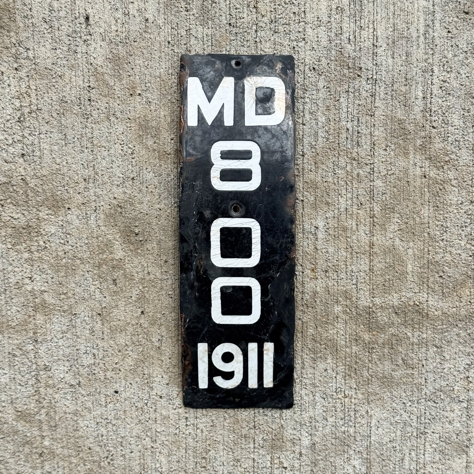 Photo of a 1911 Maryland Porcelain Motorcycle License Plate Auto Tag Garage Decor Vintage Low Number Three Digit Curved 800 with original patina