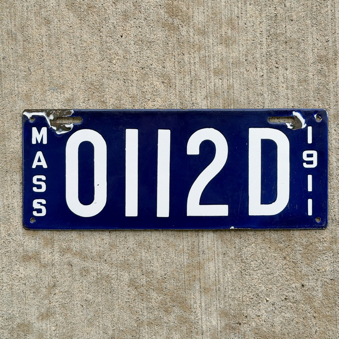 Photo of a 1911 Massachusetts Dealer License Plate Auto Tag Garage Decor Vintage High Quality 0112D with original patina