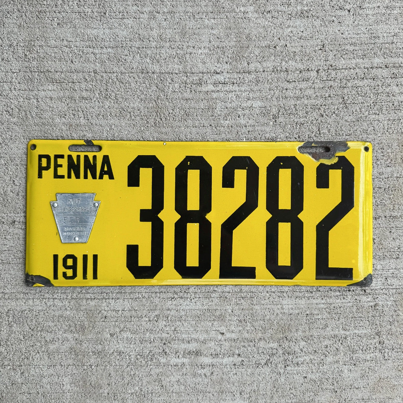 Photo of a 1911 Pennsylvania Porcelain Dealer License Plate Auto Tag Garage Decor Vintage Dishpan Type Beveled 38282 with original patina