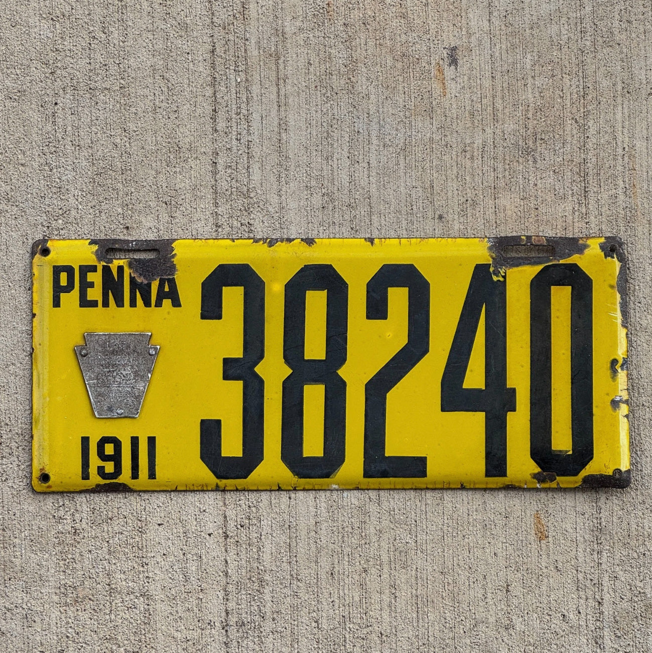 Photo of a 1911 Pennsylvania Porcelain License Plate Auto Tag Garage Decor Vintage Dishpan Type Beveled 38240 with original patina