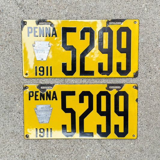 Photo of a 1911 Pennsylvania Porcelain License Plate Pair Auto Tag Garage Decor Vintage Low Number Four Digit 5299 with original patina