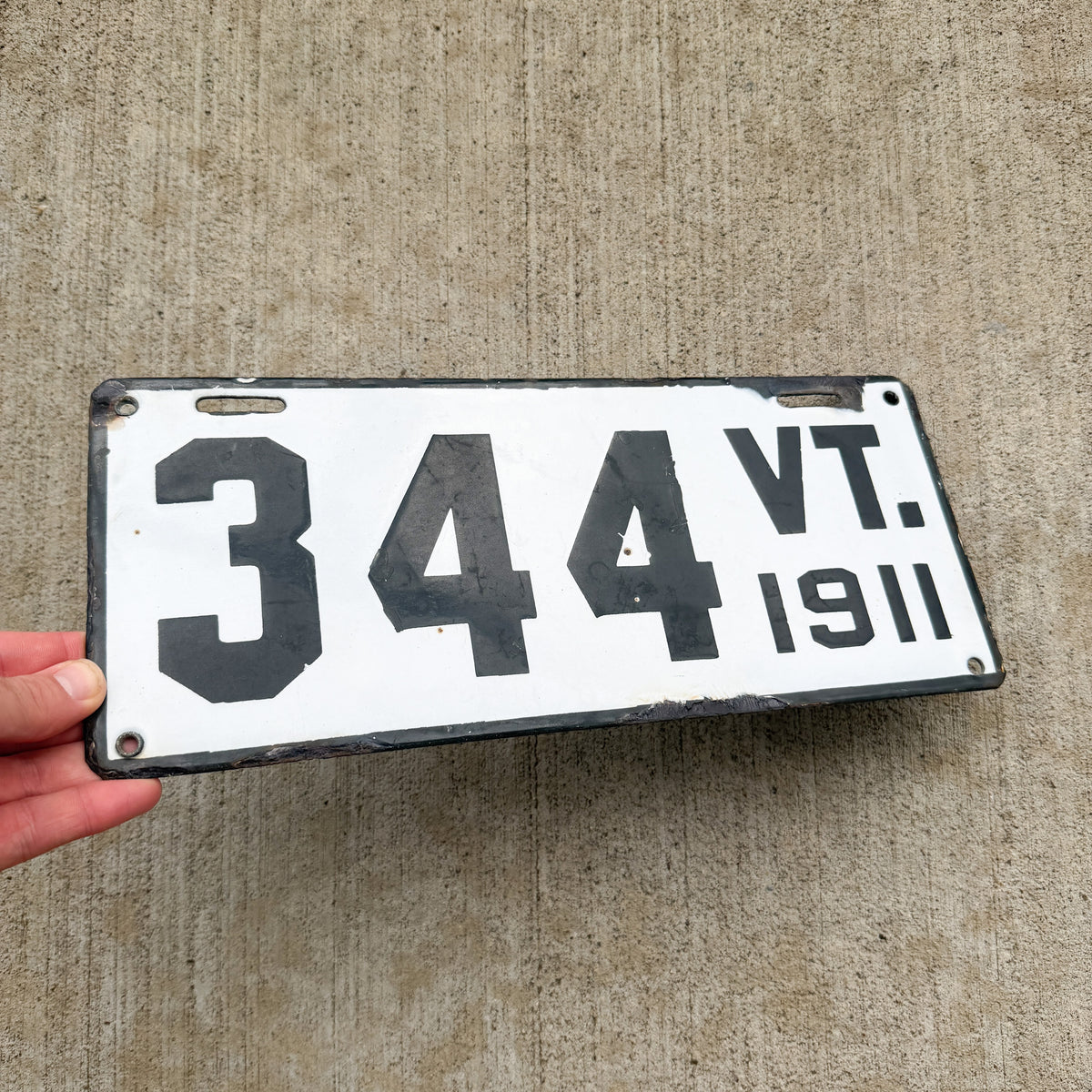 Photo of a 1911 Vermont Porcelain License Plate Auto Tag Garage Decor Vintage Low Number Three Digit 344 with original patina