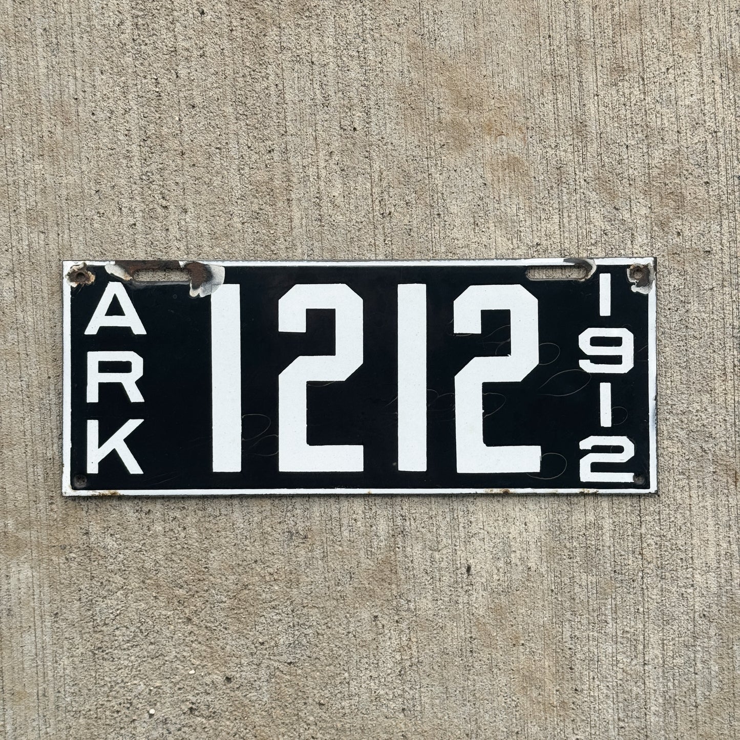 Photo of a 1912 Arkansas Porcelain License Plate Auto Tag Garage Decor Vintage Great Number High Quality 1212 with original patina