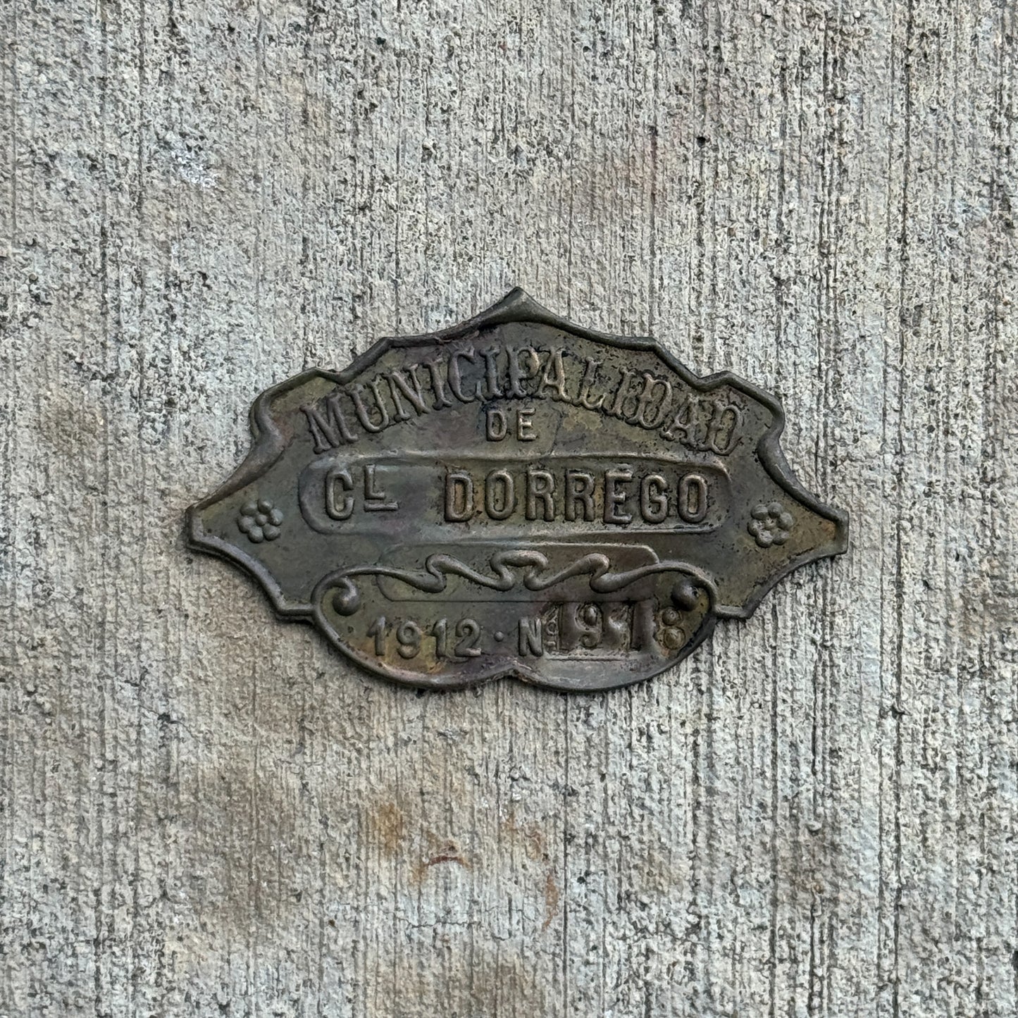 Photo of a 1912 Coronel Dorrego Argentina Auto Tag Garage Decor Vintage Badge 1918 with original patina