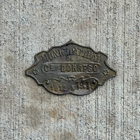 Photo of a 1912 Coronel Dorrego Argentina Auto Tag Garage Decor Vintage Badge 1918 with original patina