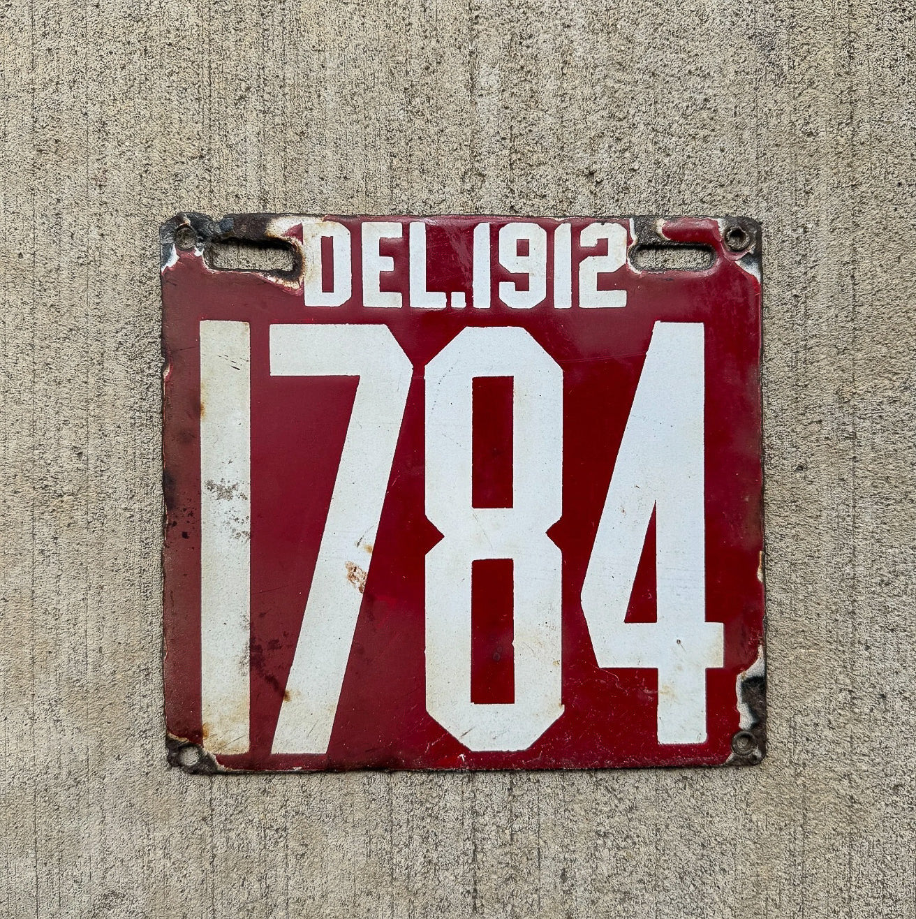 Photo of a 1912 Delaware Porcelain License Plate Auto Tag Garage Decor Vintage Four Digit Low Number High Quality 1784 with original patina