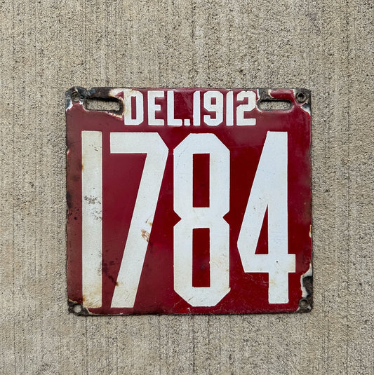 Photo of a 1912 Delaware Porcelain License Plate Auto Tag Garage Decor Vintage Four Digit Low Number High Quality 1784 with original patina