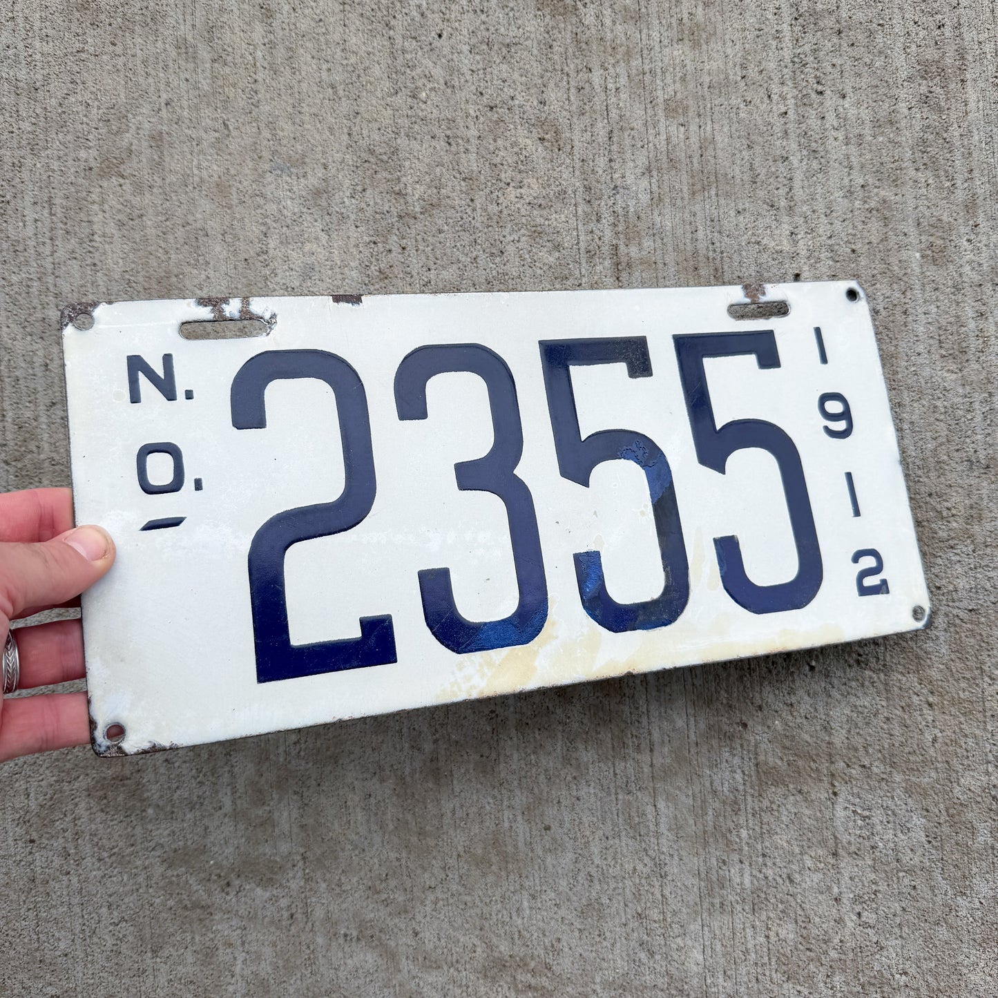 Photo of a 1912 Louisiana Porcelain License Plate Auto Tag Garage Decor Vintage High Quality 2355 with original patina