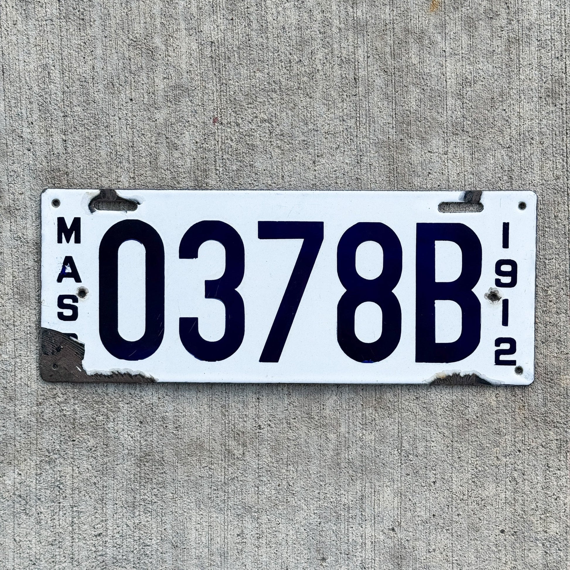 Photo of a 1912 Massachusetts Porcelain Dealer License Plate Auto Tag Garage Decor Vintage 0378 B with original patina