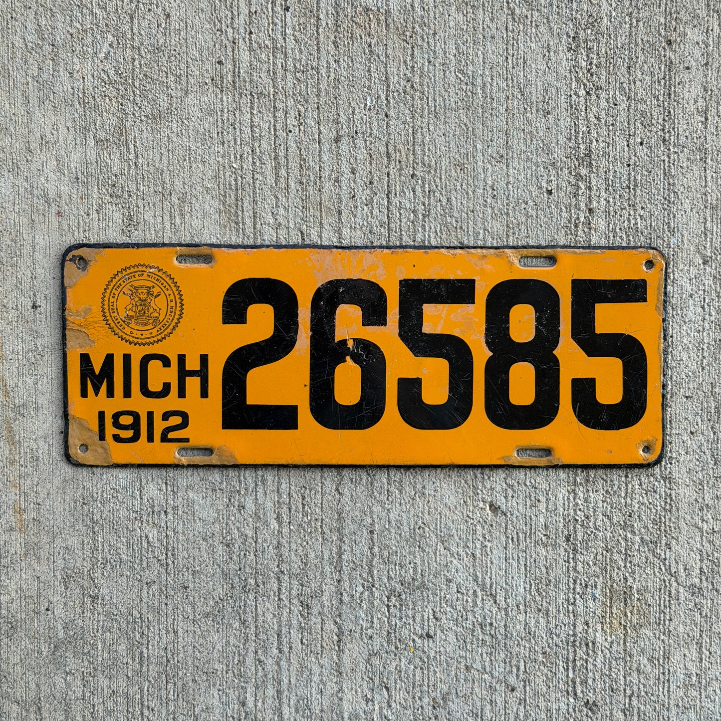Photo of a 1912 Michigan Porcelain License Plate Auto Tag Garage Decor Vintage 26585 with original patina