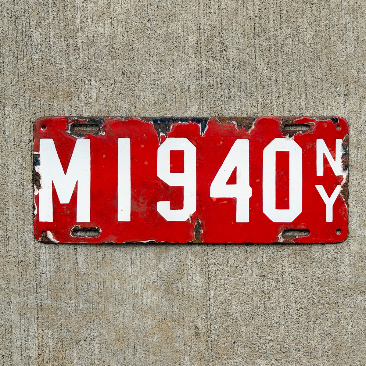 Photo of a 1912 New York Porcelain Dealer License Plate Auto Tag Garage Decor Vintage Manufacturer M 1940 with original patina