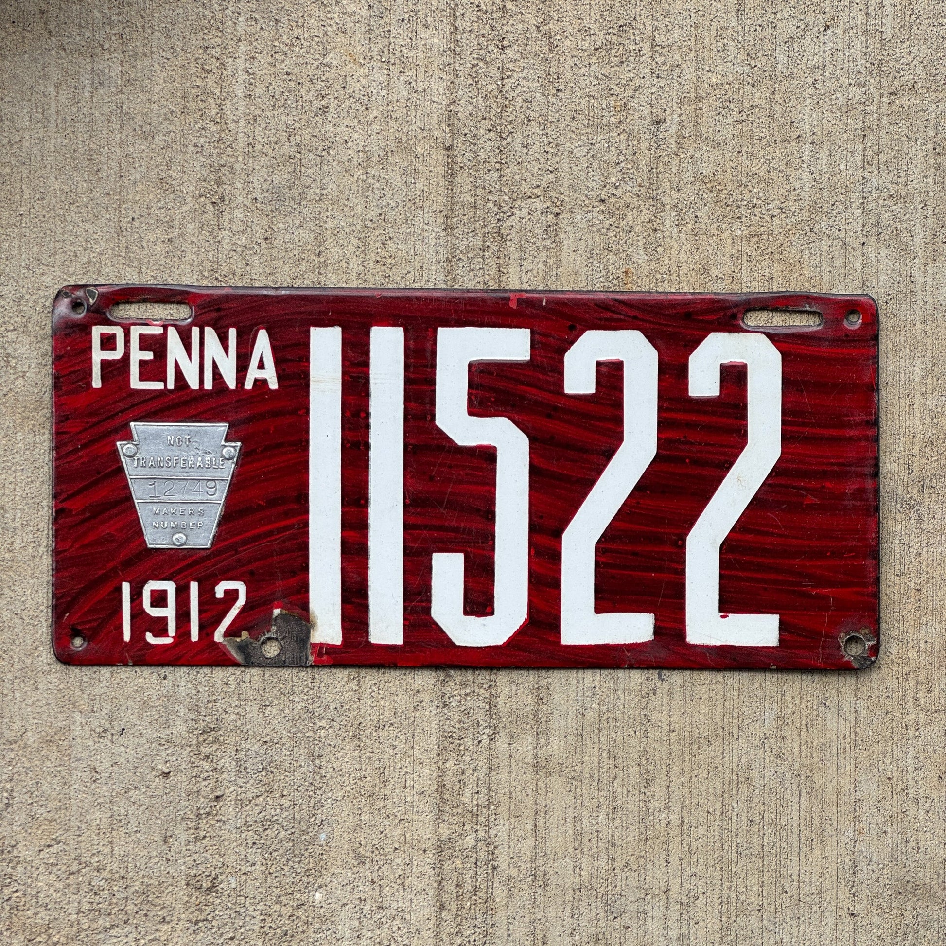 Photo of a 1912 Pennsylvania Porcelain License Plate Auto Tag Garage Decor Vintage Wood Grain 11522 with original patina