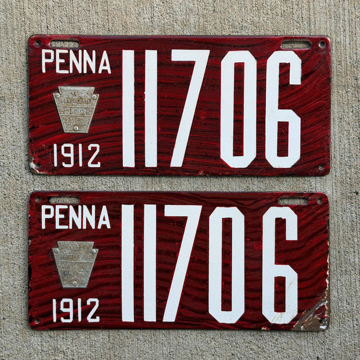 Photo of a 1912 Pennsylvania Porcelain License Plate Pair Auto Tag Garage Decor Vintage Wood Grain 11706 with original patina