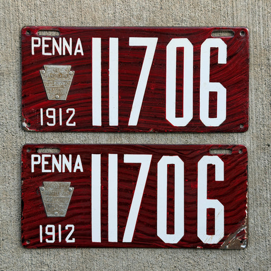 Photo of a 1912 Pennsylvania Porcelain License Plate Pair Auto Tag Garage Decor Vintage Wood Grain 11706 with original patina