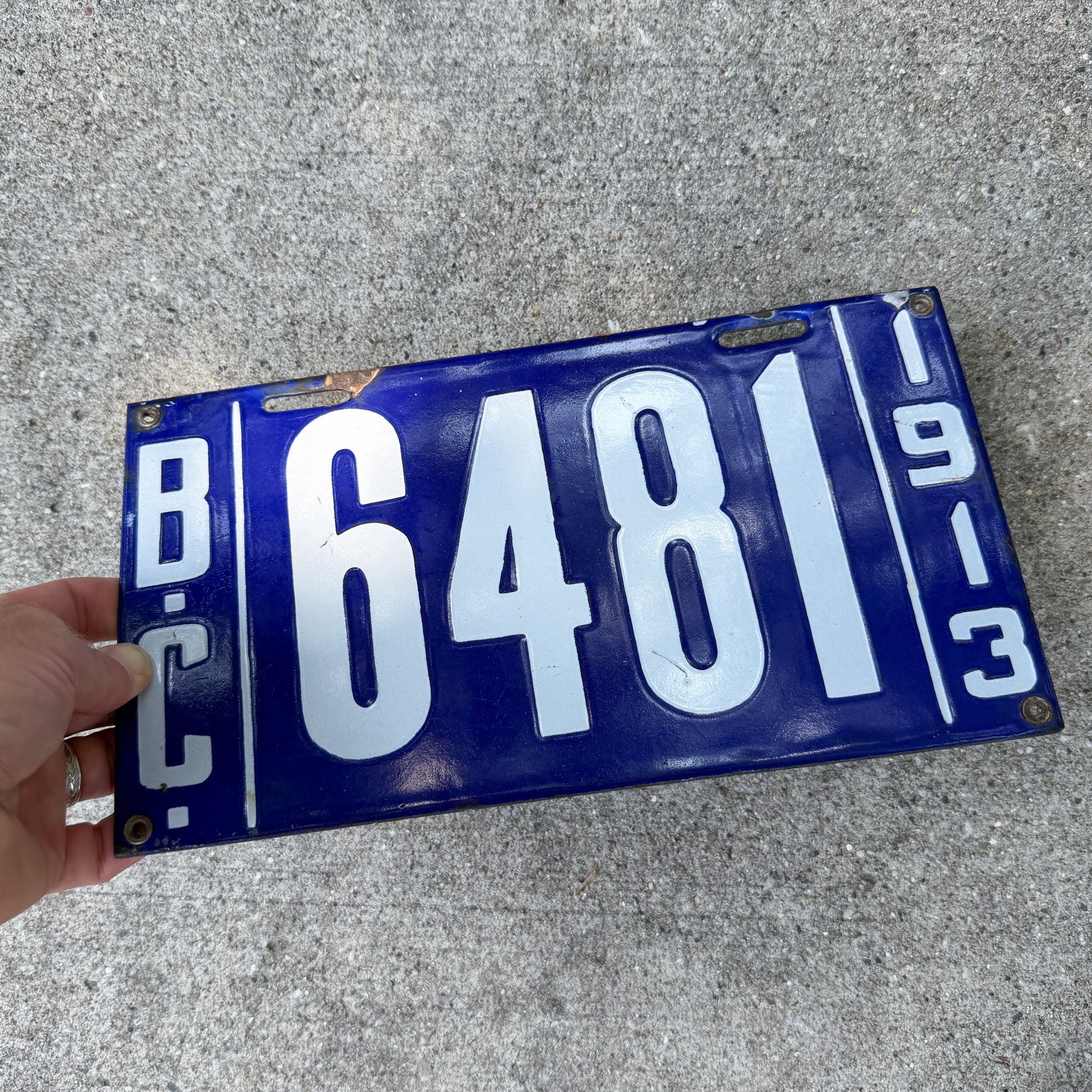 Photo of a 1913 British Columbia Porcelain License Plate Auto Tag Garage Decor Vintage High Quality 6481 with original patina