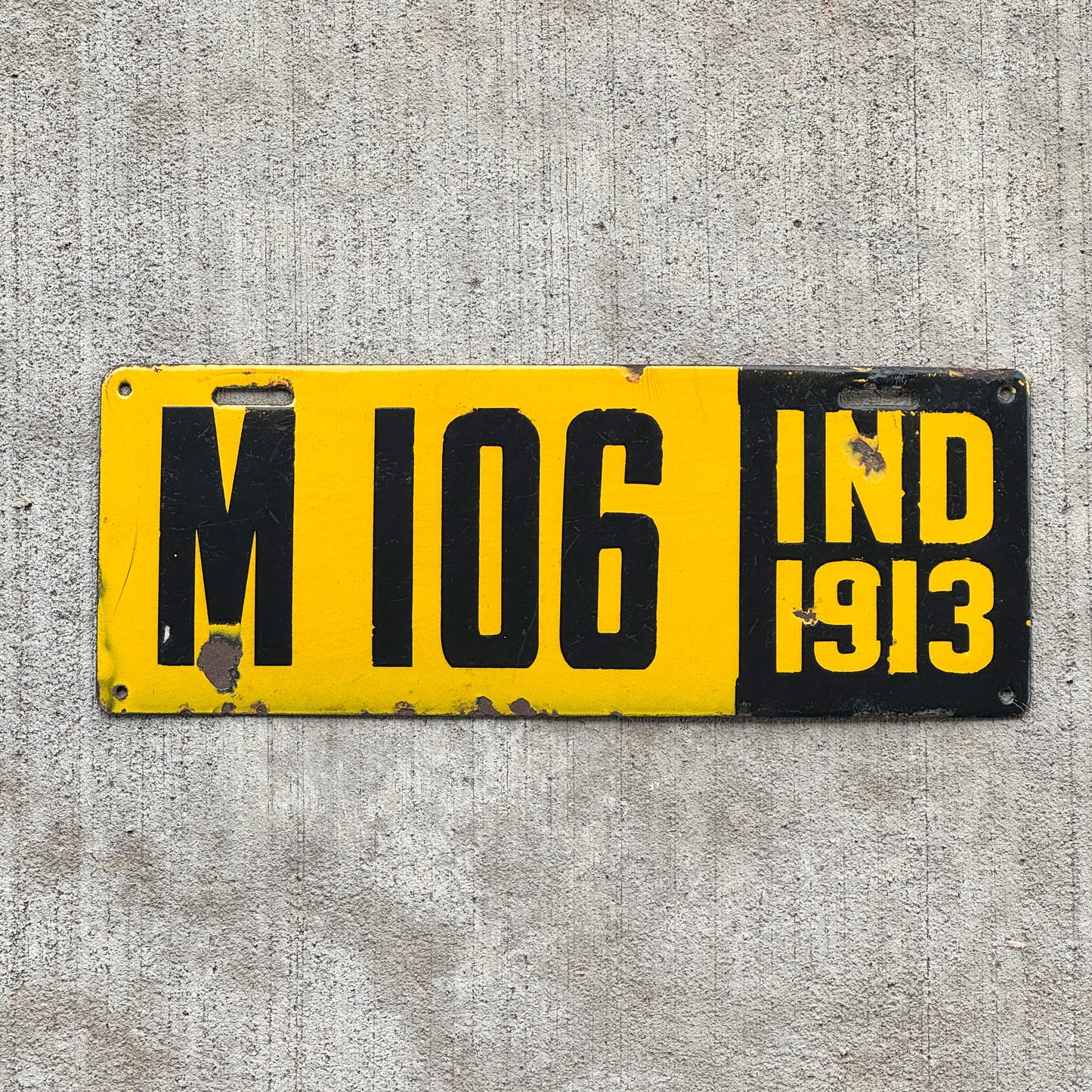Photo of a 1913 Indiana Porcelain Manufacturer License Plate Auto Tag Garage Decor Vintage High Quality M 106 with original patina