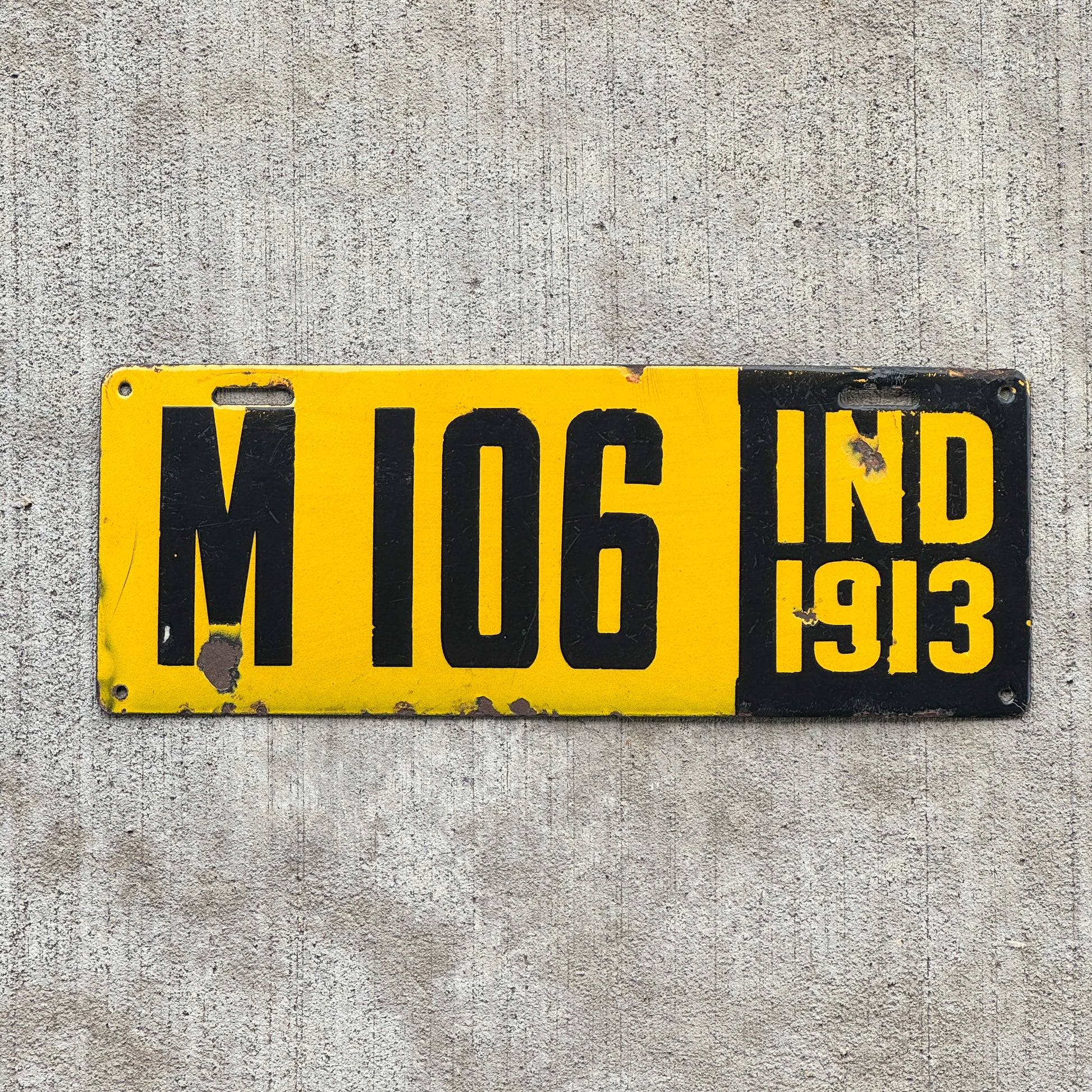 Photo of a 1913 Indiana Porcelain Manufacturer License Plate Auto Tag Garage Decor Vintage High Quality M 106 with original patina