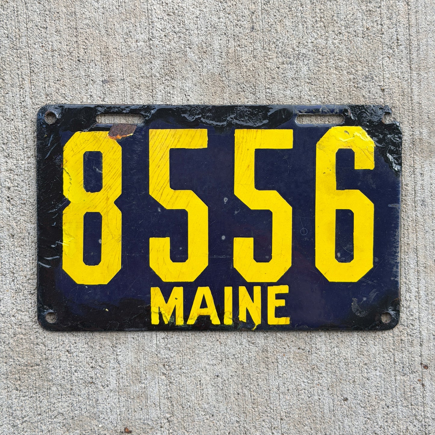 Photo of a 1913 Maine Porcelain License Plate Auto Tag Garage Decor Vintage Low Number Four Digit 8556 with original patina