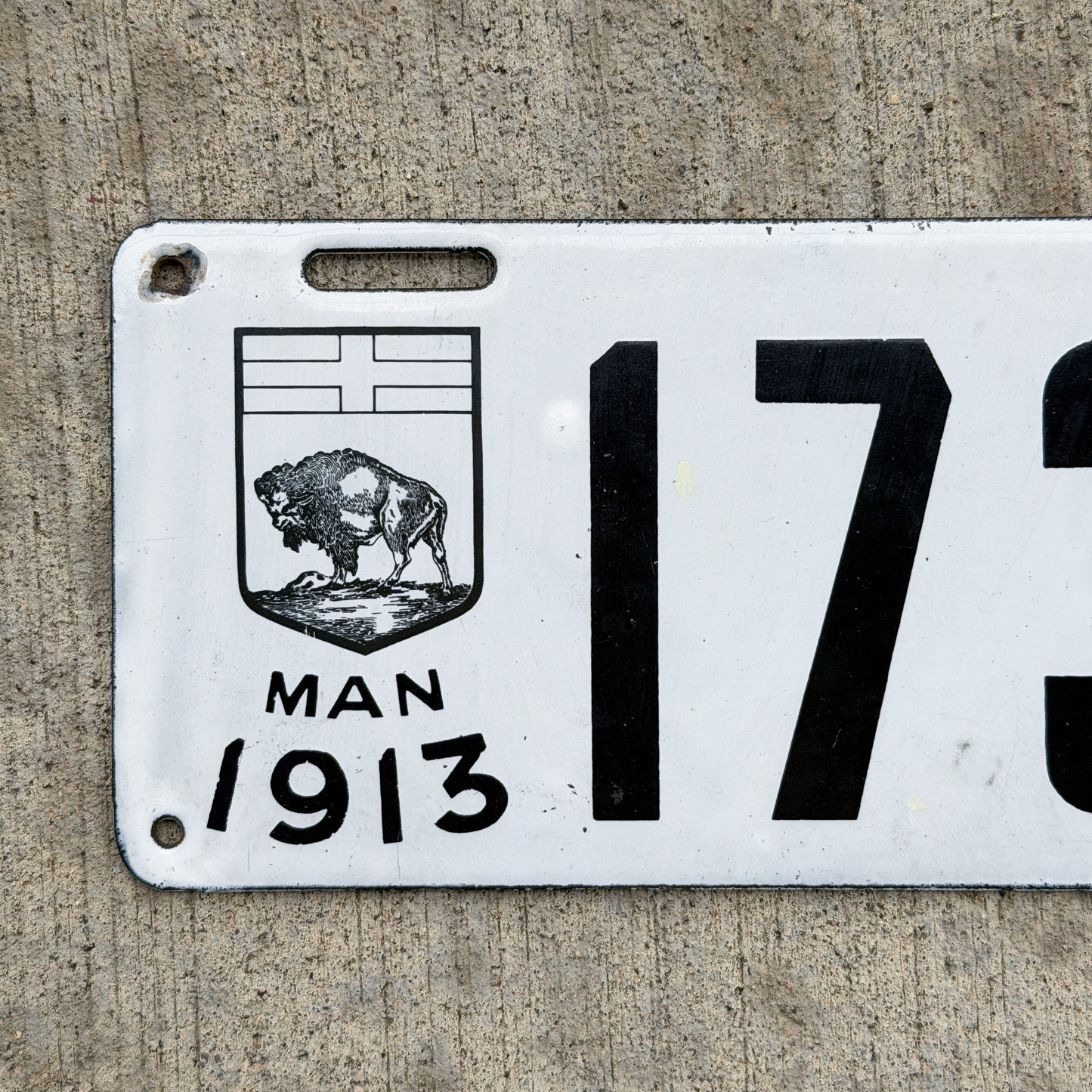 Photo of a 1913 Manitoba Porcelain License Plate Auto Tag Garage Decor Vintage High Quality 1734 with original patina
