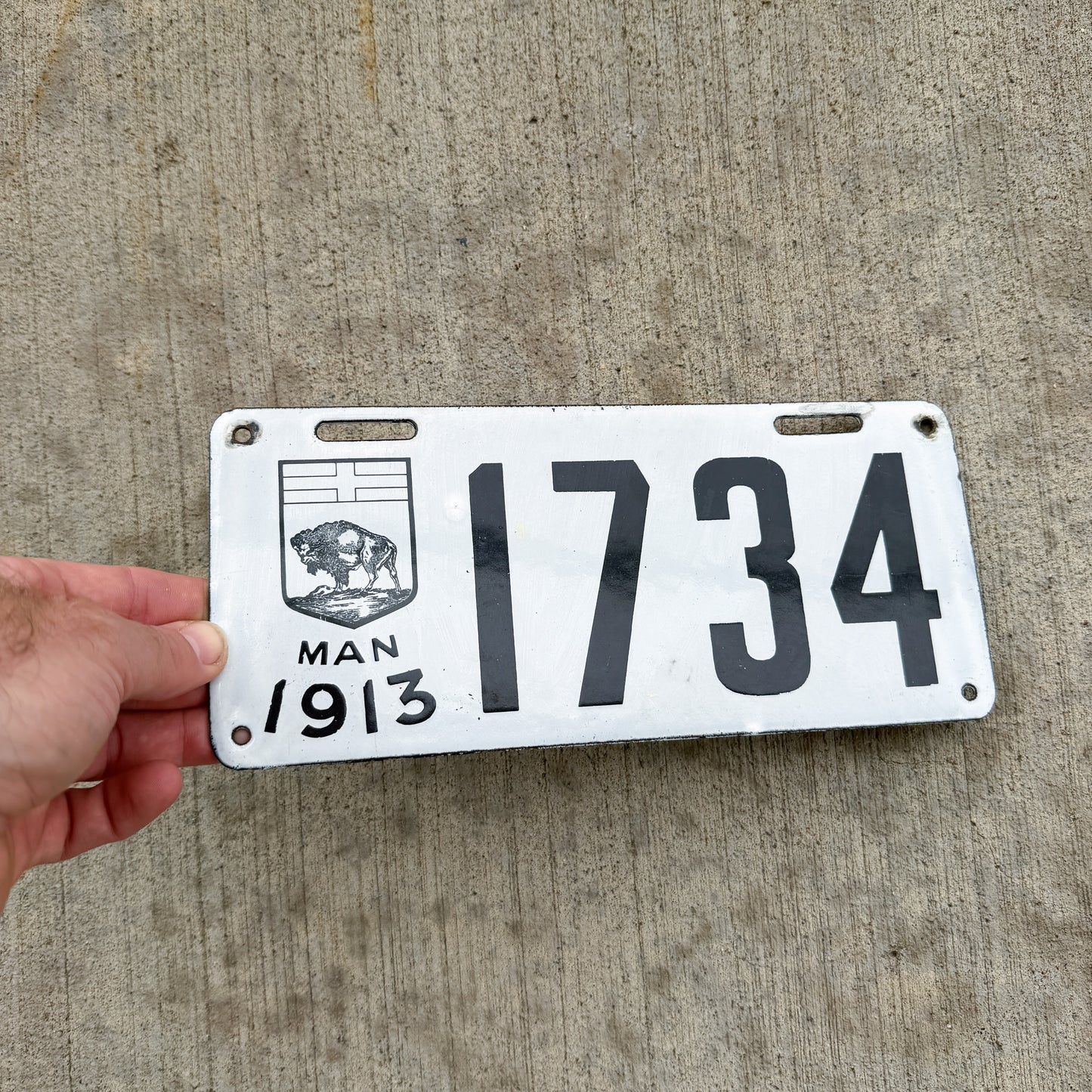 Photo of a 1913 Manitoba Porcelain License Plate Auto Tag Garage Decor Vintage High Quality 1734 with original patina