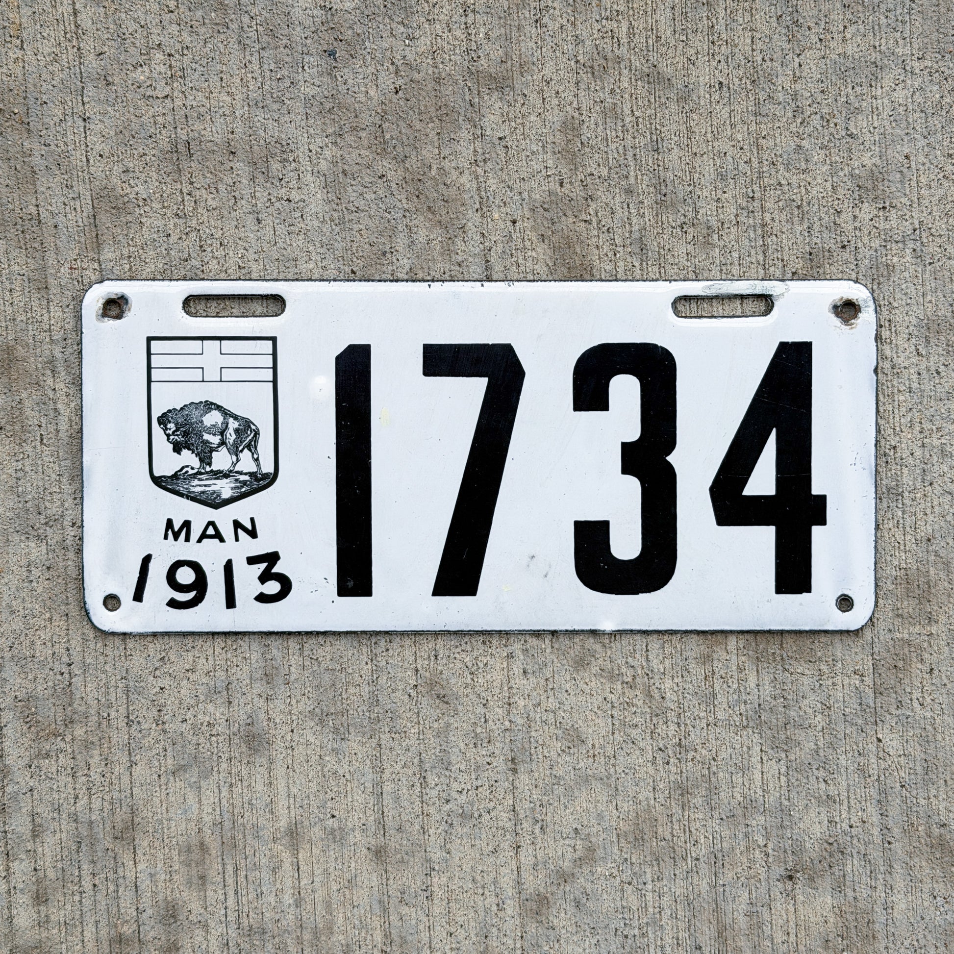 Photo of a 1913 Manitoba Porcelain License Plate Auto Tag Garage Decor Vintage High Quality 1734 with original patina