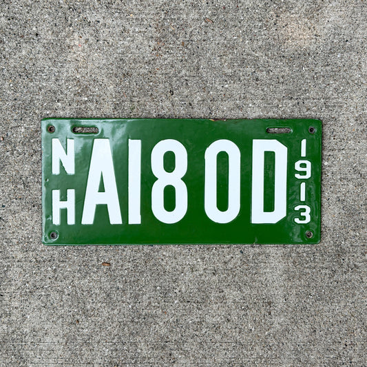 Photo of a 1913 New Hampshire Porcelain Dealer License Plate Auto Tag Garage Decor Vintage High Quality A 180 D with original patina