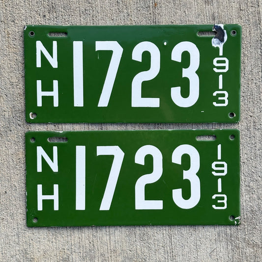 Photo of a 1913 New Hampshire Porcelain License Plate Pair Auto Tag Garage Decor Vintage Low Number Four Digit High Quality 1723 with original patina