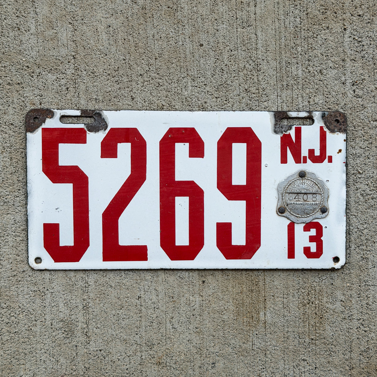 Photo of a 1913 New Jersey Porcelain License Plate Auto Tag Garage Decor Vintage Low Number Four Digit 5269 with original patina
