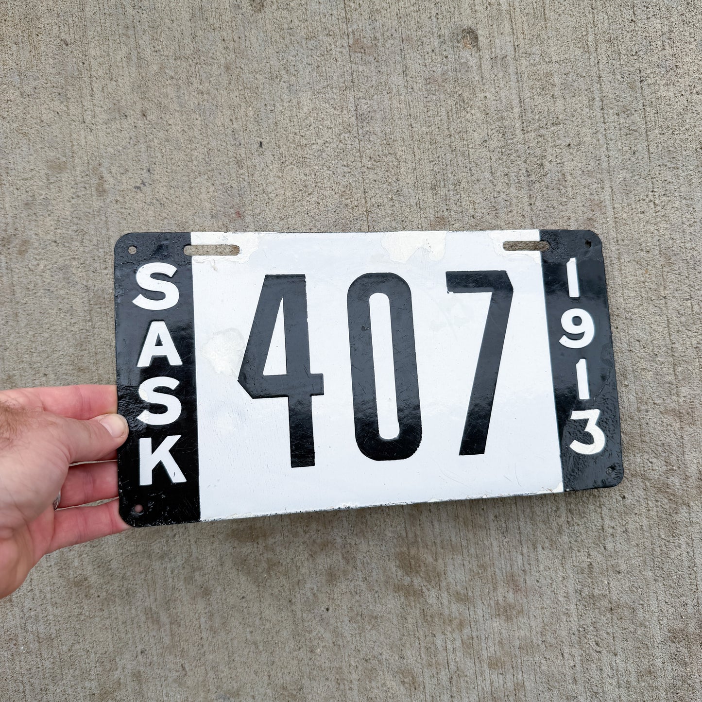Photo of a 1913 Saskatchewan Porcelain License Plate Auto Tag Garage Decor Vintage 407 with original patina