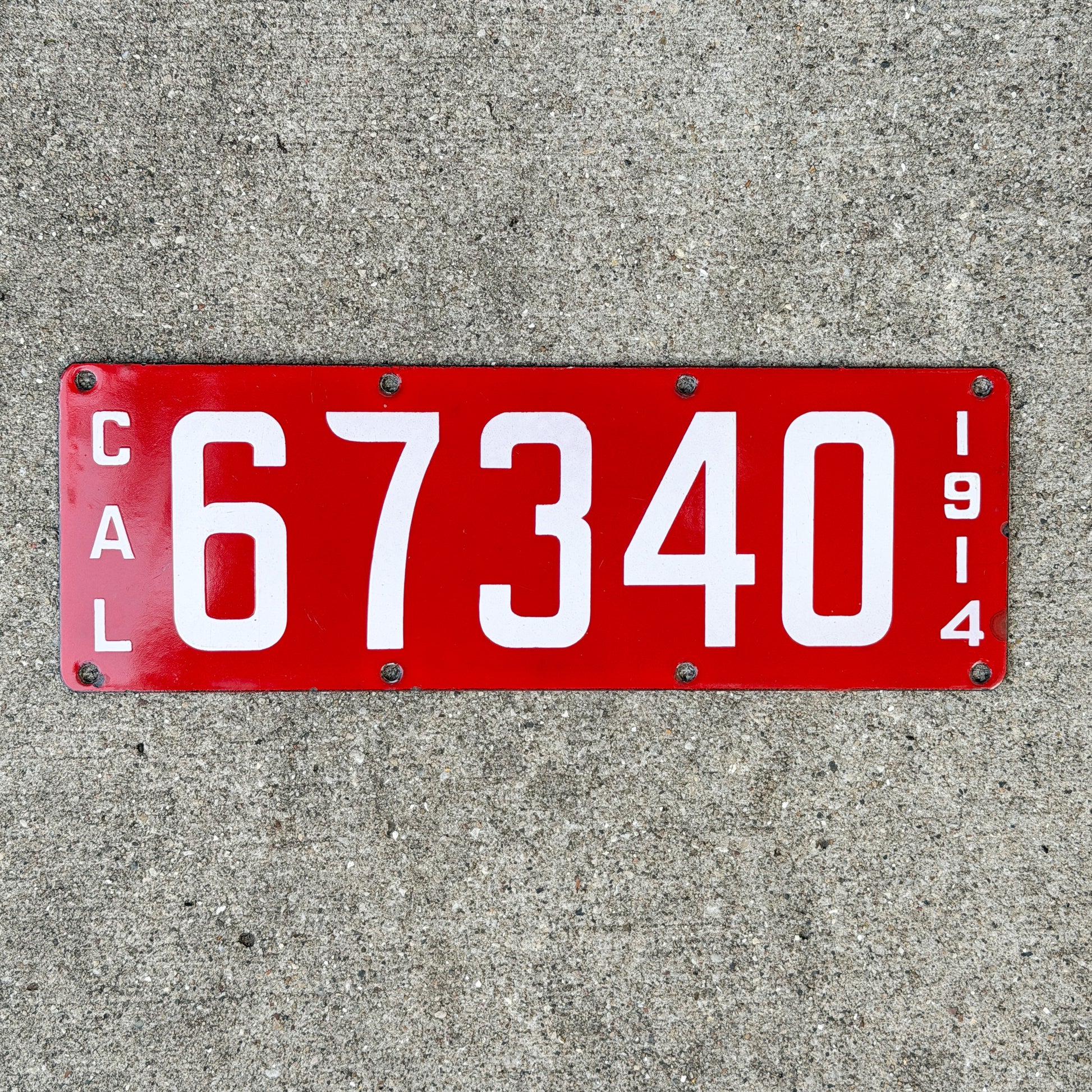 Photo of a 1914 California Porcelain License Plate Auto Tag Garage Decor Vintage First Issue 67340 with original patina