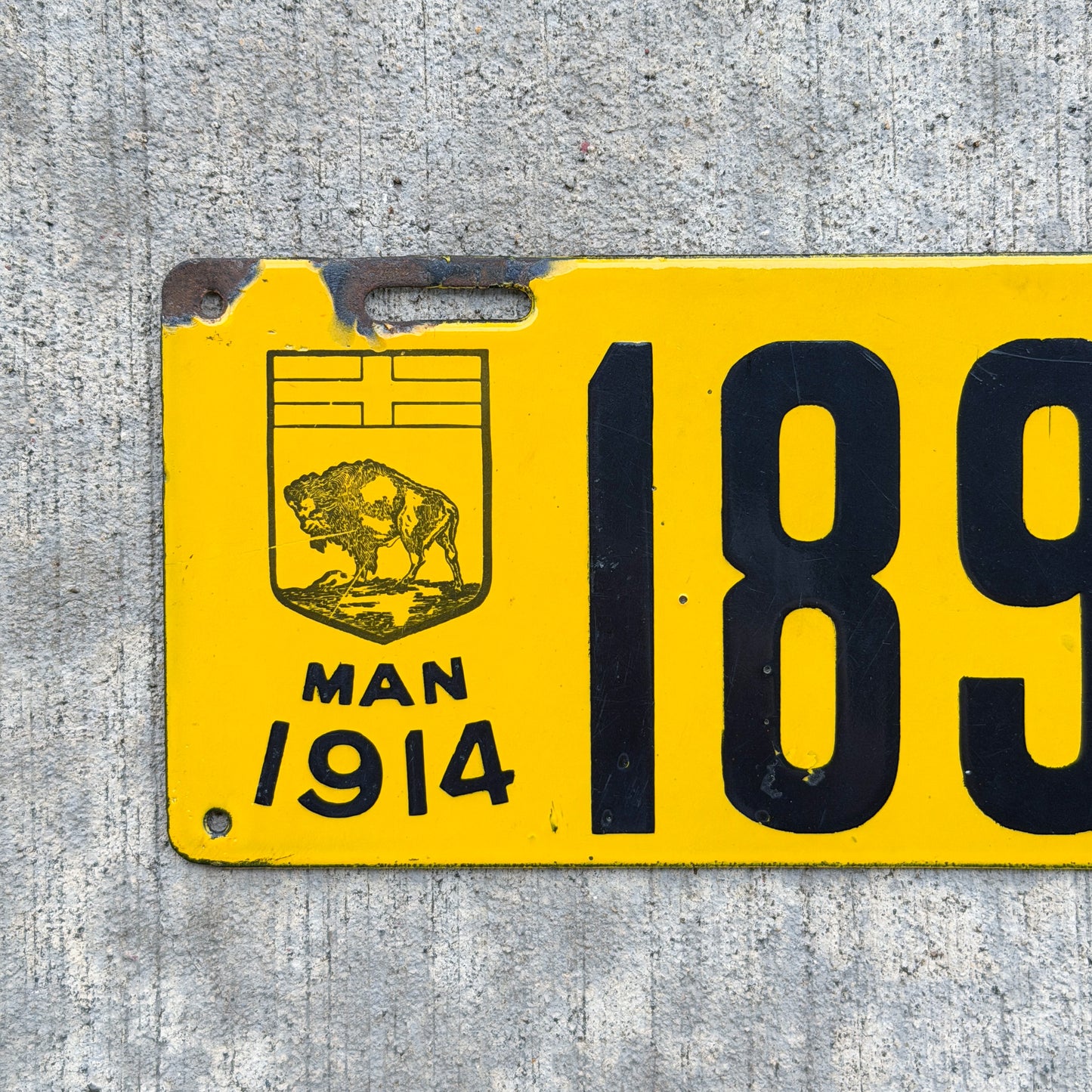 Photo of a 1914 Manitoba Porcelain License Plate Auto Tag Garage Decor Vintage High Quality 1893 with original patina