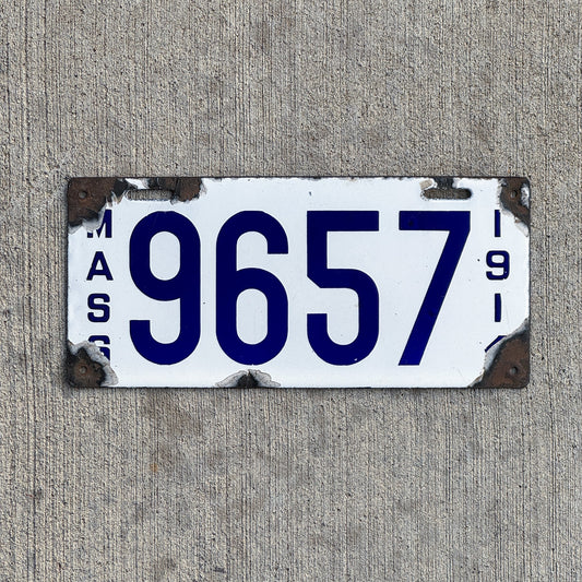 Photo of a 1914 Massachusetts Porcelain License Plate Auto Tag 1 Vintage Garage Low Number Four Digit 9657 with original patina