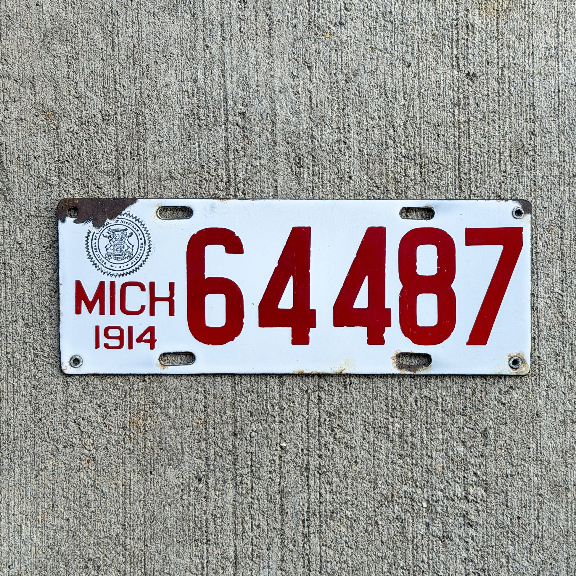 Photo of a 1914 Michigan Porcelain License Plate Auto Tag Garage Decor Vintage 64487 with original patina