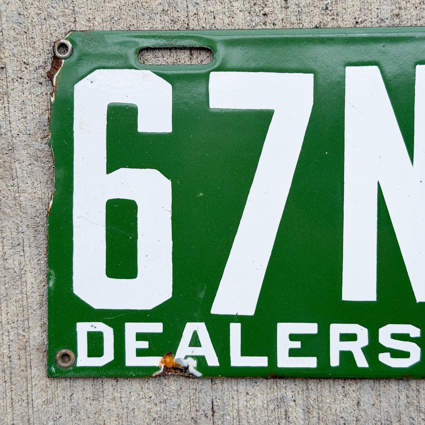 Photo of a 1914 New Brunswick Porcelain Dealer License Plate Auto Tag Garage Decor Vintage High Quality Low Number Two Digit 67 with original patina
