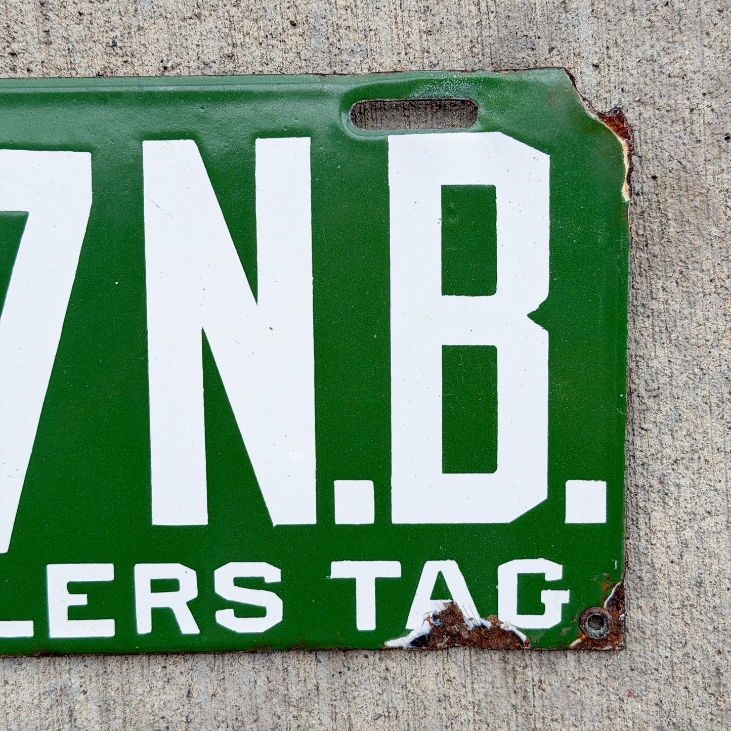 Photo of a 1914 New Brunswick Porcelain Dealer License Plate Auto Tag Garage Decor Vintage High Quality Low Number Two Digit 67 with original patina