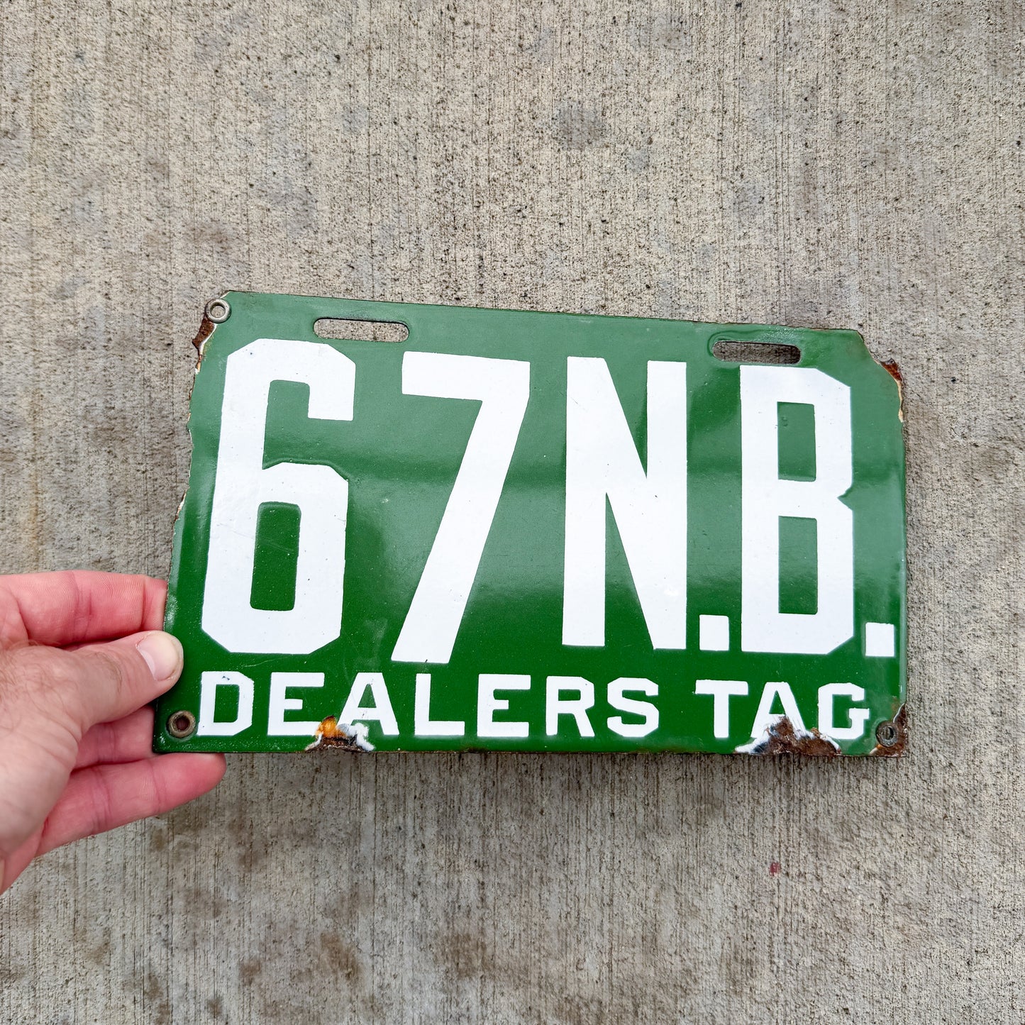 Photo of a 1914 New Brunswick Porcelain Dealer License Plate Auto Tag Garage Decor Vintage High Quality Low Number Two Digit 67 with original patina