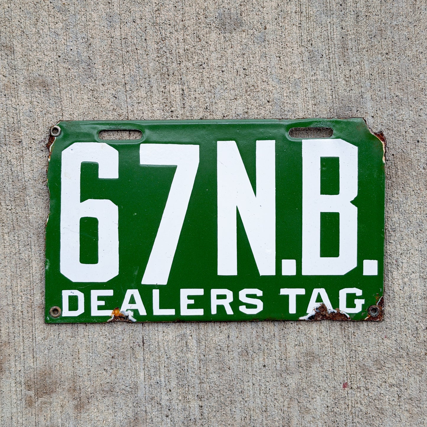 Photo of a 1914 New Brunswick Porcelain Dealer License Plate Auto Tag Garage Decor Vintage High Quality Low Number Two Digit 67 with original patina