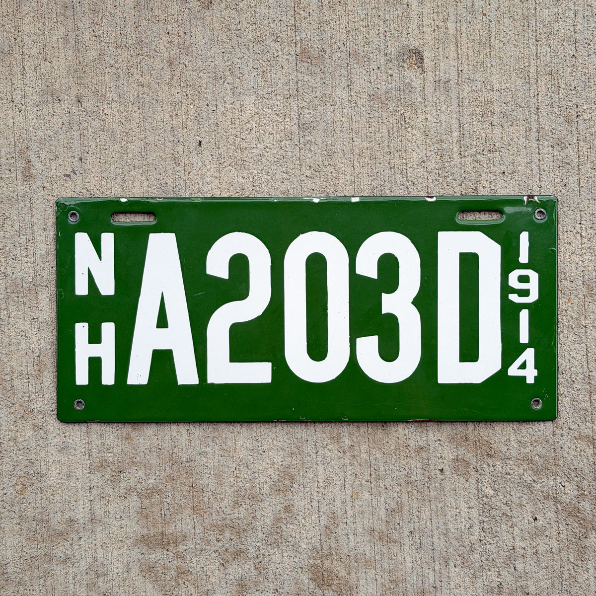 Photo of a 1914 New Hampshire Porcelain Dealer License Plate Auto Tag Garage Decor Vintage High Quality A 203 D with original patina