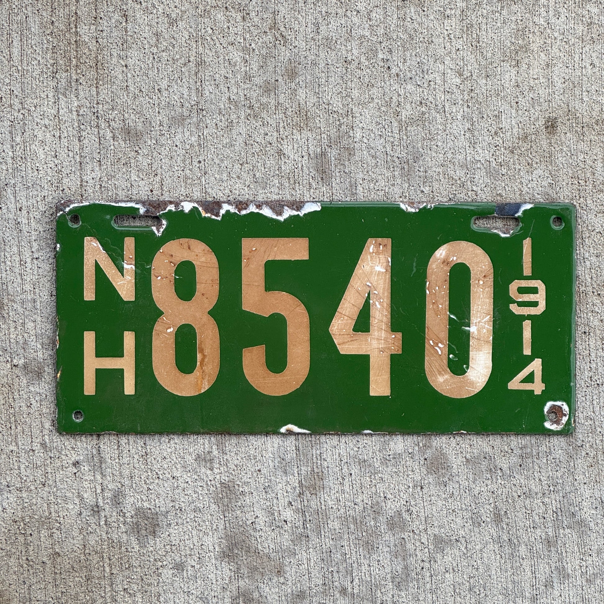 Photo of a 1914 New Hampshire Porcelain License Plate Auto Tag Garage Decor Vintage Low Number Four Digit 8540 with original patina