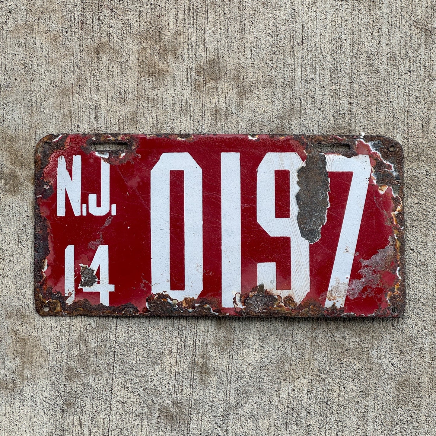 Photo of a 1914 New Jersey Porcelain Temporary License Plate Auto Tag Garage Decor Vintage Hard to Find Type 0197 with original patina