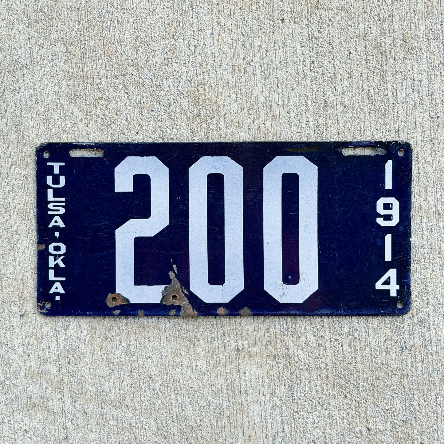 Photo of a 1914 Oklahoma Porcelain License Plate Auto Tag Garage Decor Vintage High Quality 200 with original patina