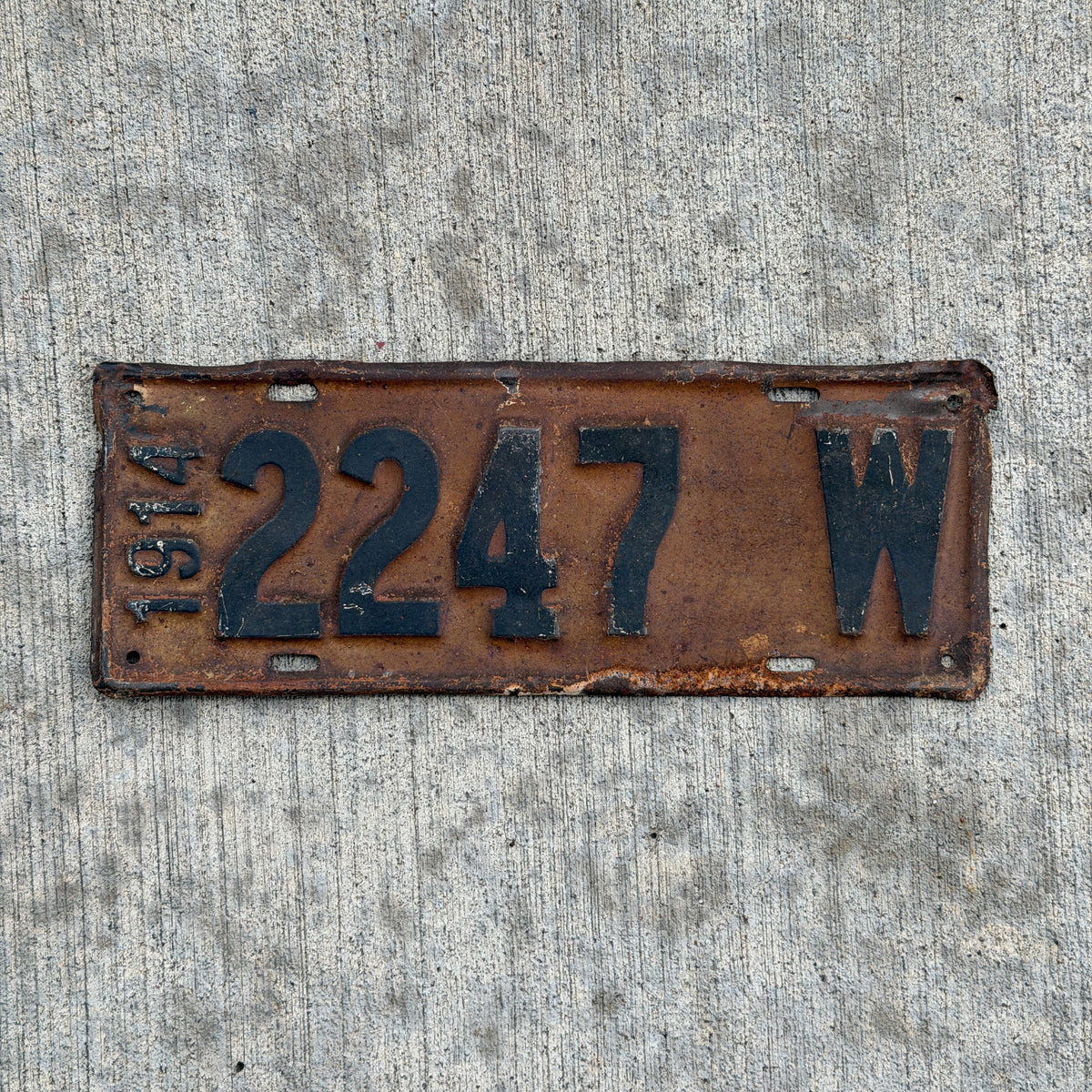 Photo of a 1914 Wisconsin License Plate Auto Tag Garage Decor Vintage Low Number Four Digit 2247 with original patina