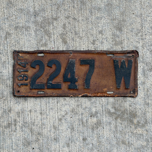 Photo of a 1914 Wisconsin License Plate Auto Tag Garage Decor Vintage Low Number Four Digit 2247 with original patina